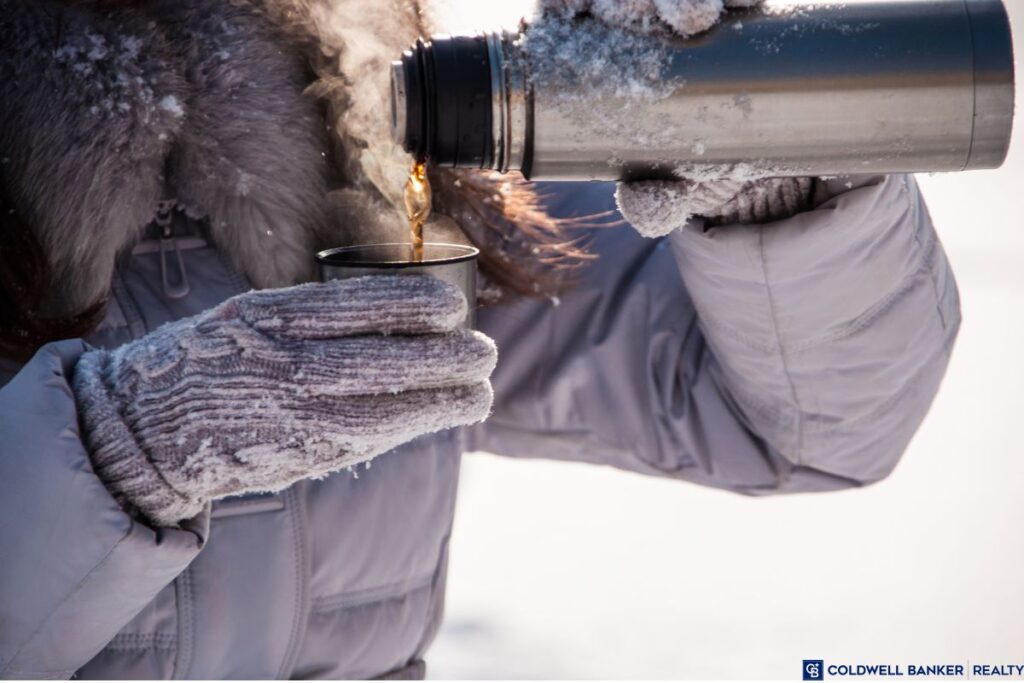 Woman pouring out of a thermos